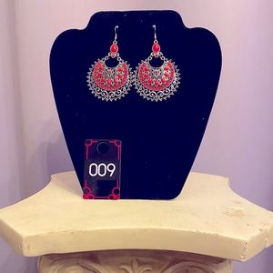 These PINK and silver color earrings are full of unique detail!